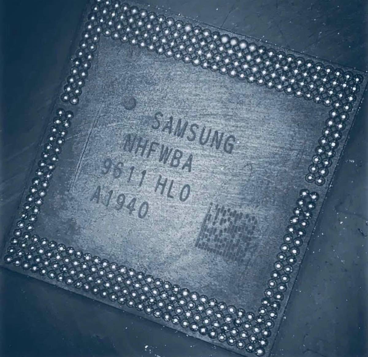 Extreme close-up of a Samsung BGA memory chip removed from a phone motherboard